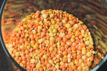 Glass pot  full of red and yellow lentils