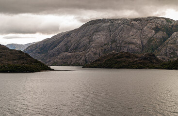 Sarmiento Channel, Chile - December 11, 2008: Amalia Glacier and Fjord. Cloudscape covers top of...