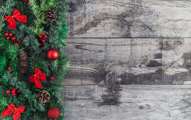 Christmas holiday garland on an old rustic wood background