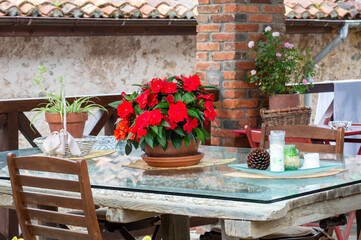 table and chairs at a rural house's porch