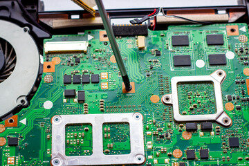 Fixing electronic components with the screwdriver inside the pc. Computer hardware, service,...