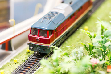 Railway modelling. Close-up about model train on the rail tracks
