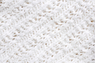 White knitted texture and background, close up.