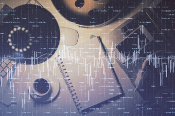 Multi exposure of forex chart drawing and work table top veiw. Concept of financial analysis.