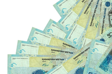 500 Kazakhstani tenge bills lies in different order isolated on white. Local banking or money making concept