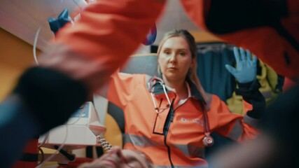 EMS Paramedics Team Provide Medical Help to Injured Patient on the Way to Hospital