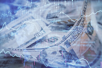 Double exposure of forex graph drawing over us dollars bill background. Concept of financial markets.
