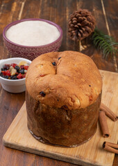 Traditional italian christmas fruit cake panettone with ingredients