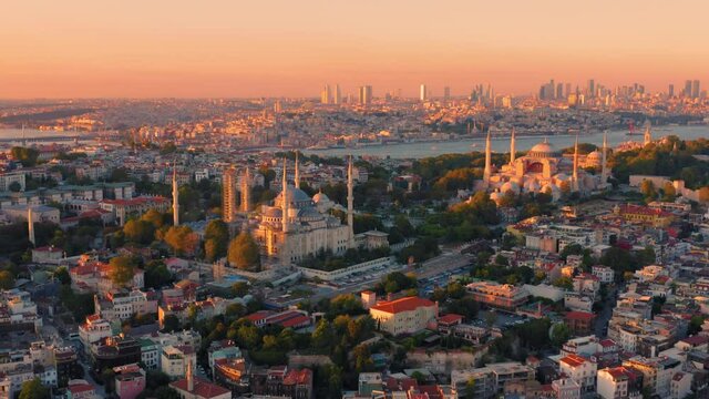 Istanbul, Turkey. Sultanahmet with the Blue Mosque and the Hagia Sophia (Ayasofya) with a Golden Horn on the background at sunset. Aerial view