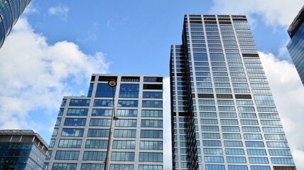 Obraz premium Bottom view of modern office buildings in the business district