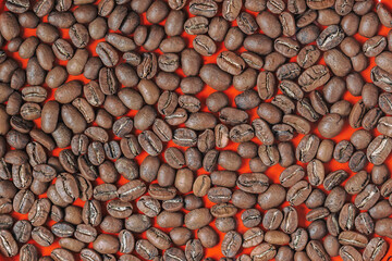 Background of roasted grains of dark coffee, top view, texture. Breakfast, coffee break concept.