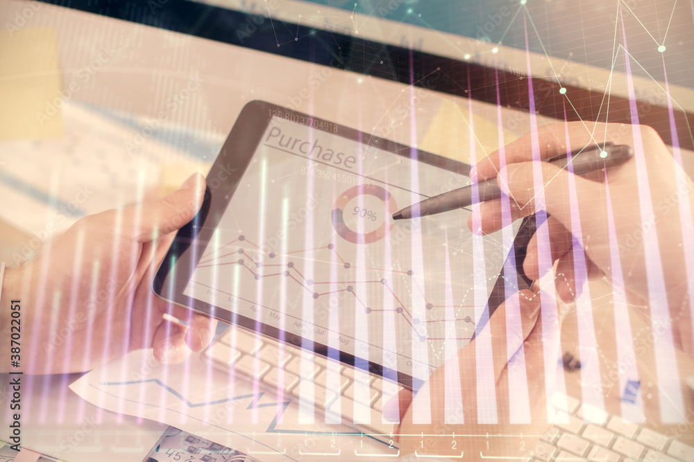Poster double exposure of man's hands holding and using a phone and financial chart drawing. market analysi