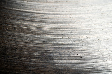 Abstract metal or scratched iron surface background. Old used car brake disc, macro photo close up.