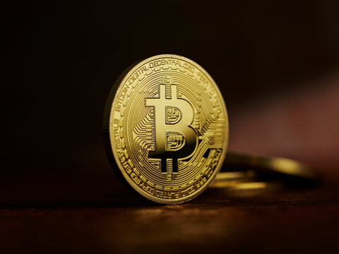 Studio shot of a Bitcoin against a dark background.