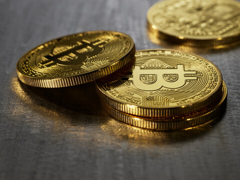 Bitcoins against a steel surface