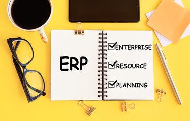 Notebook with Toolls and Notes about ERP, concept