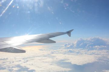 Obraz premium fluffy clouds in the sky shot from plane