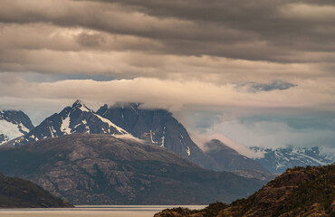 Sarmiento Channel, Chile - December 11, 2008: Amalia Glacier and Fjord. Brown and gray cloudscape...