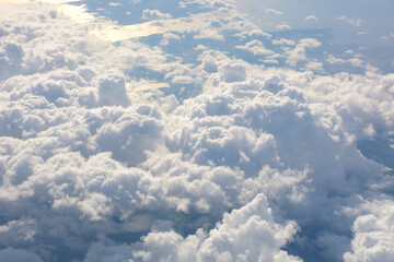 fluffy clouds in the sky shot from plane