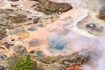 Colorful geothermal hot springs, geysers and mudpots at Artists Paint Pots in Yellowstone National Park, Wyoming