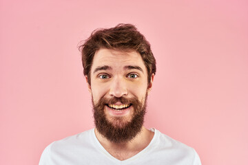 Bearded man white t-shirt cropped view lifestyle studio pink background