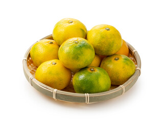 Early Japanese mandarin oranges on a white background