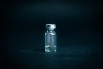 close up. medical ampoule on a dark background.