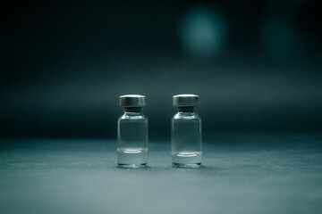 close up. two medical ampoules on a dark background.