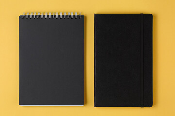 Fototapeta premium leather notebook on a yellow background top view