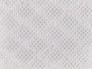 Background texture Wallpaper of textured white embossed tissue paper.The structure of the toilet...