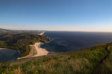 A view of the Oregon Coastal mountains and ocean toward the horizon as seen from the top of the Cascade Head Preserve