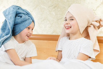 two cute little girls with towel on their heads