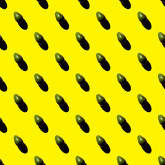 Pattern with avocado on a yellow background. Fruit pattern with avocado.