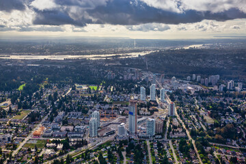 Aerial view of a modern cityscape during a sunny summer morning. Taken in Burnaby, Greater Vancouver, British Columbia, Canada.