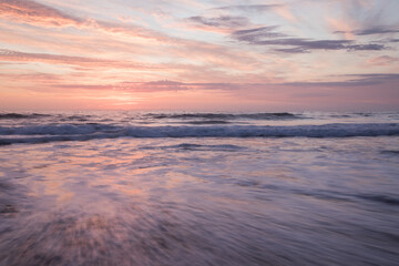 Fototapeta premium Sunrise over slow motion blurred water 