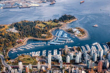 Aerial view of Coal Harbour and a modern Downtown City during a vibrant sunny morning. Taken in...