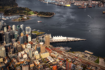 Obraz premium Aerial View of Downtown Vancouver, Coal Harbour and Stanley Park. Taken during a bright sunny morning in British Columbia, Canada. Modern Cityscape from above.