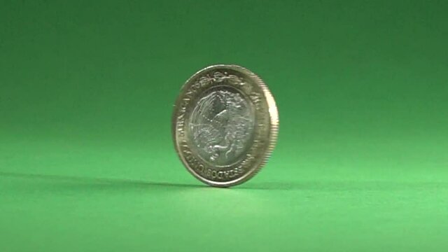 Mexican coin spinning in a chroma background.