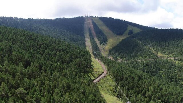 Zlatibor Mountain, Serbia. Aerial View of Tornik Summit, Gold Gondola Lift Route Through Pine Forest on Sunny Summer Day