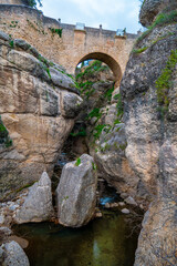 Fototapeta na wymiar Low angle view of Old Bridge of Ronda, Spain