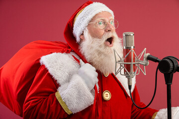 Santa Claus singing or speaking in a studio microphone. Merry Christmas. Broadcaster. Announcer....