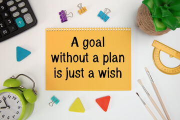 A goal without a plan is just a wish - motivational text on a notepad