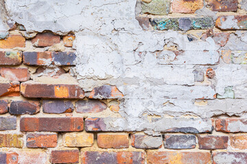 A fragment of an old brick wall of a 19th century glass factory, built in the Baroque style in the Siberian outback in the Krasnoyarsk Territory