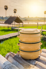 Fototapeta premium Zinc coated food carrier in Thailand countryside, beautiful natural farm atmosphere in the morning