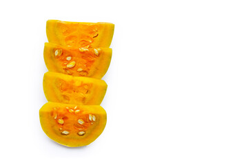 Cut and slices butternut squash on white