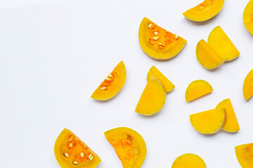 Cut and slices butternut squash on white