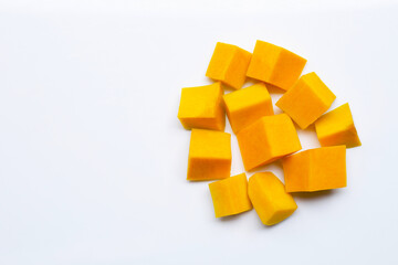 Cut and slices butternut squash on white