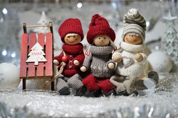 Christmas winter scence. Children (toys) on sleds.Christmas background