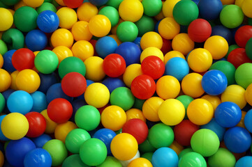 Fototapeta na wymiar red, yellow, green, blue plastic balls closeup