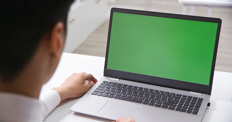 man look green screen laptop